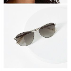 Kate spade sunglasses.  Gold frame